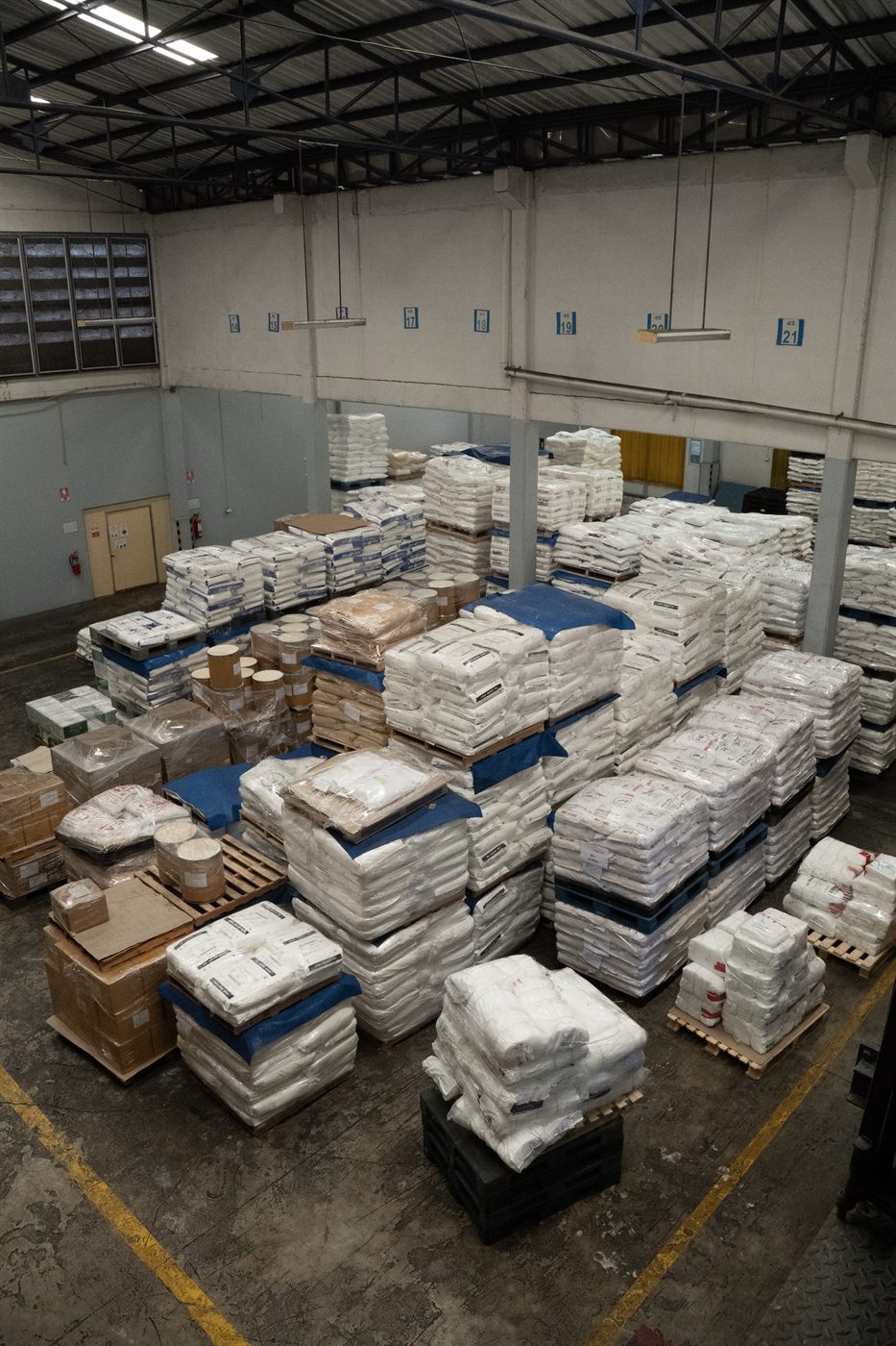 Raw material pallets stored at Jirakorn's production facility