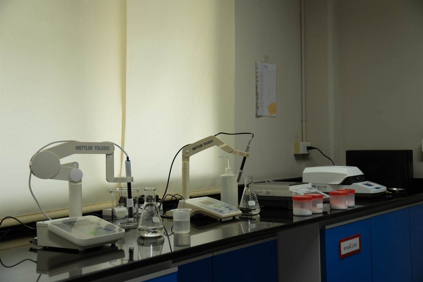 Jirakorn's in-house QC laboratory with moisture and pH testing equipment