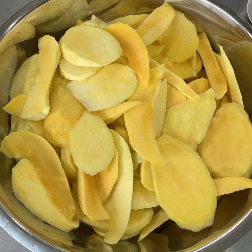 Fresh mango slices, prepped for trial
