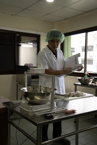 Weighing and recording shrimp trial samples